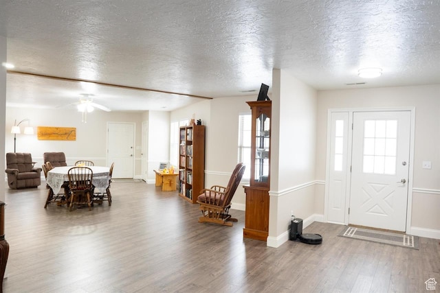 731 Pioneer Dr, Soda Springs, ID 83276 - foyer featuring wood finished floors, a textured ceiling, healthy amount of natural light, ceiling fan, and baseboards
