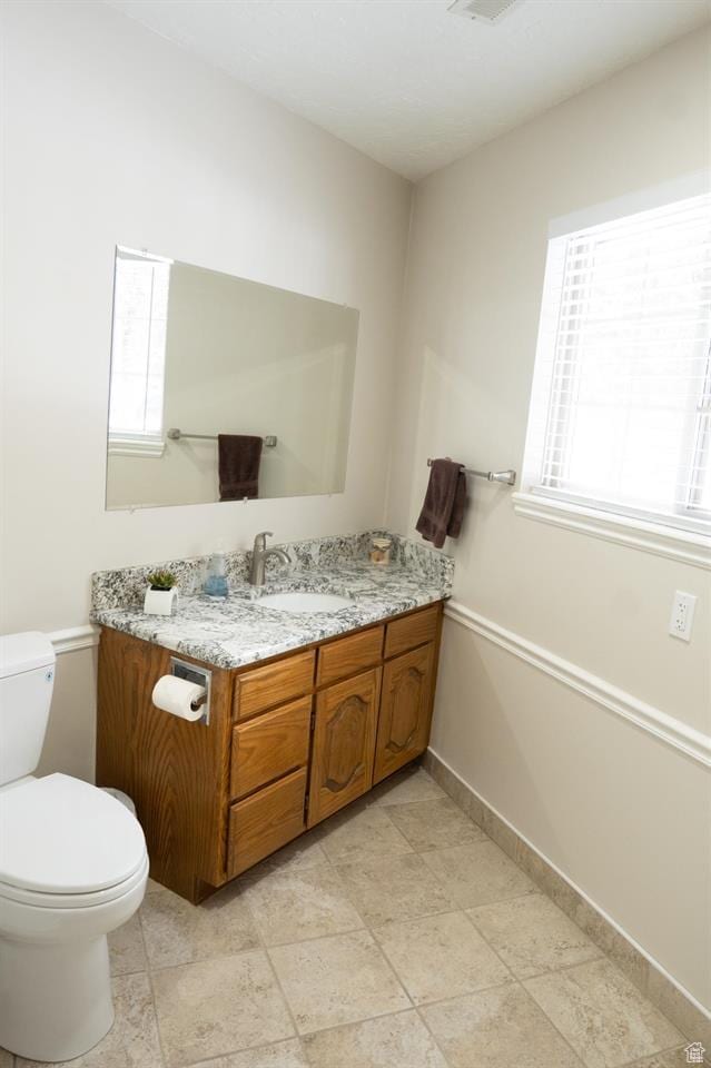 731 Pioneer Dr, Soda Springs, ID 83276 - half bath featuring vanity, toilet, and baseboards