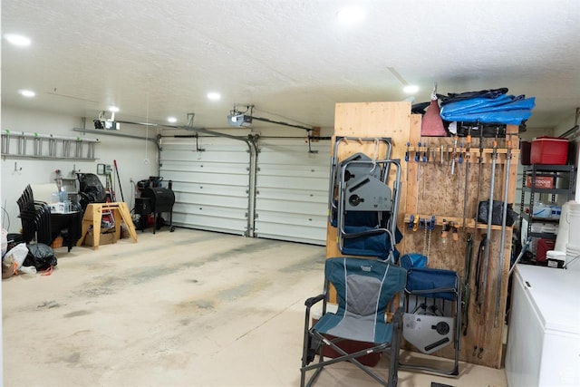 731 Pioneer Dr, Soda Springs, ID 83276 - garage featuring a garage door opener, recessed lighting, and refrigerator