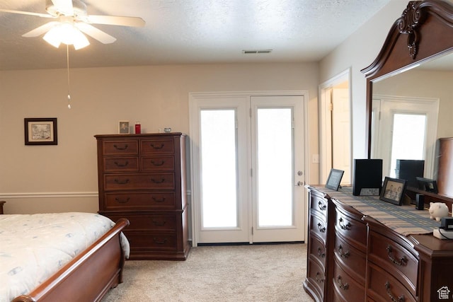 731 Pioneer Dr, Soda Springs, ID 83276 - bedroom featuring light colored carpet, access to outside, a textured ceiling, and a ceiling fan