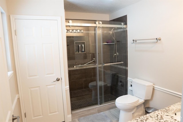 731 Pioneer Dr, Soda Springs, ID 83276 - bathroom with toilet, vanity, and a stall shower