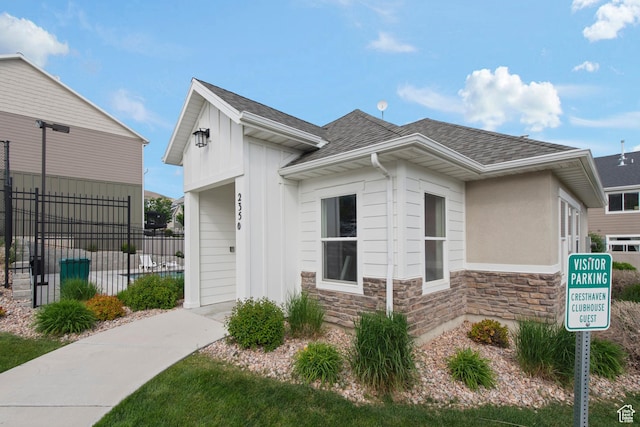 2335 W Cresthaven Ln, Lehi, UT 84043 - view of home's exterior featuring stone siding and roof with shingles