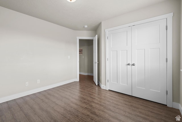 2335 W Cresthaven Ln, Lehi, UT 84043 - unfurnished bedroom featuring wood finished floors, baseboards, and a closet