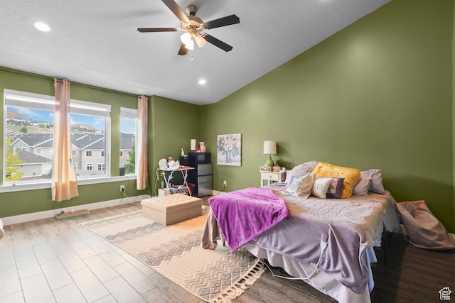 2335 W Cresthaven Ln, Lehi, UT 84043 - bedroom with vaulted ceiling, recessed lighting, baseboards, a ceiling fan, and wood finished floors