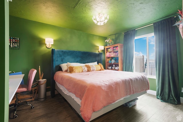 2335 W Cresthaven Ln, Lehi, UT 84043 - bedroom with wood finished floors, a textured ceiling, and baseboards