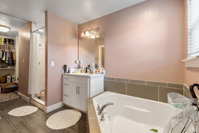 2335 W Cresthaven Ln, Lehi, UT 84043 - full bathroom with a bath, vanity, a walk in closet, a shower stall, and wood finished floors