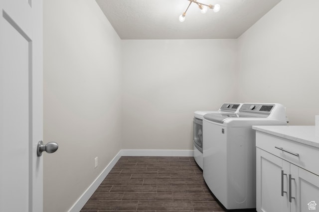 2335 W Cresthaven Ln, Lehi, UT 84043 - washroom with independent washer and dryer, baseboards, dark wood finished floors, a textured ceiling, and cabinet space