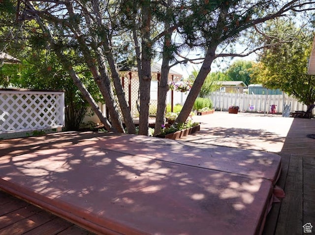 260 W 4th S, Soda Springs, ID 83276 - wooden deck with a fenced backyard and a patio area