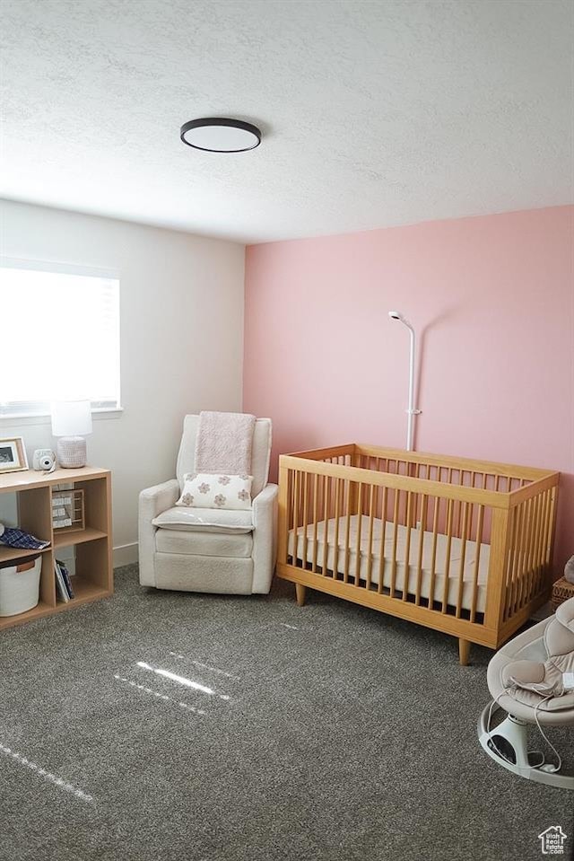 431 E Hooper Ave, Soda Springs, ID 83276 - carpeted bedroom featuring a textured ceiling and a crib