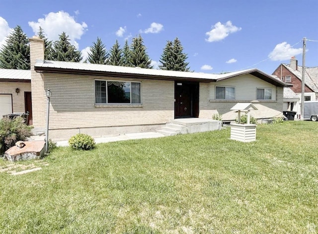 431 E Hooper Ave, Soda Springs, ID 83276 - ranch-style house with a front lawn, brick siding, and a chimney