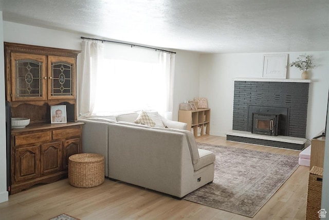 431 E Hooper Ave, Soda Springs, ID 83276 - living area featuring light wood finished floors and a fireplace