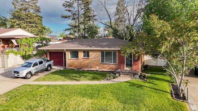2079 W 3900 S, Roy, UT 84067 - ranch-style home with driveway, an attached garage, brick siding, and a front yard