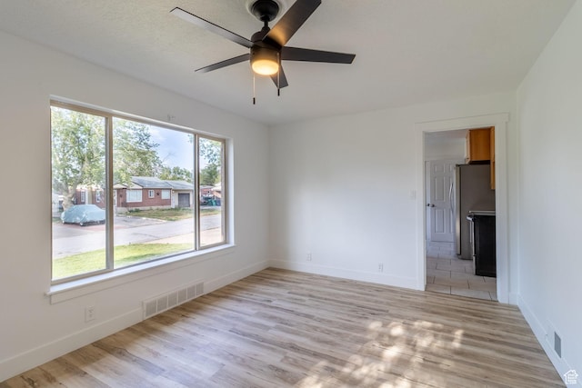 2079 W 3900 S, Roy, UT 84067 - empty room with light wood-type flooring, ceiling fan, and baseboards