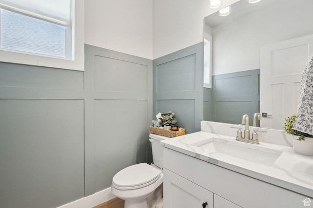 13321 S Split Oak Dr, Herriman, UT 84096 - bathroom featuring a decorative wall, vanity, toilet, and a wainscoted wall