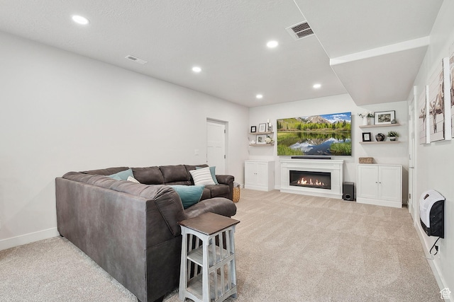 13321 S Split Oak Dr, Herriman, UT 84096 - carpeted living room with a lit fireplace, recessed lighting, and baseboards