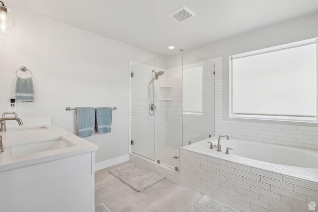 13321 S Split Oak Dr, Herriman, UT 84096 - full bathroom with a bath, a stall shower, double vanity, and tile patterned floors