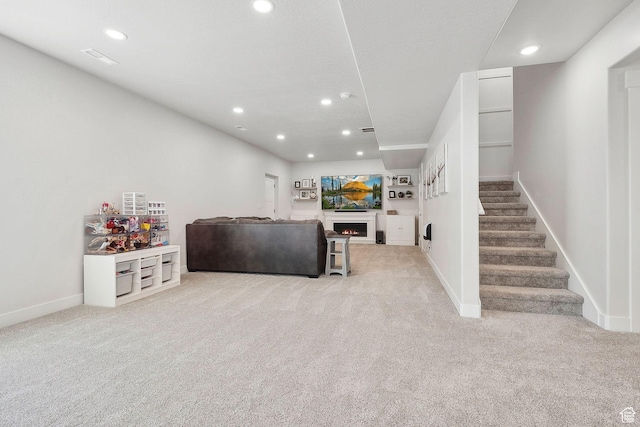 13321 S Split Oak Dr, Herriman, UT 84096 - carpeted living area with stairs, recessed lighting, a lit fireplace, and baseboards