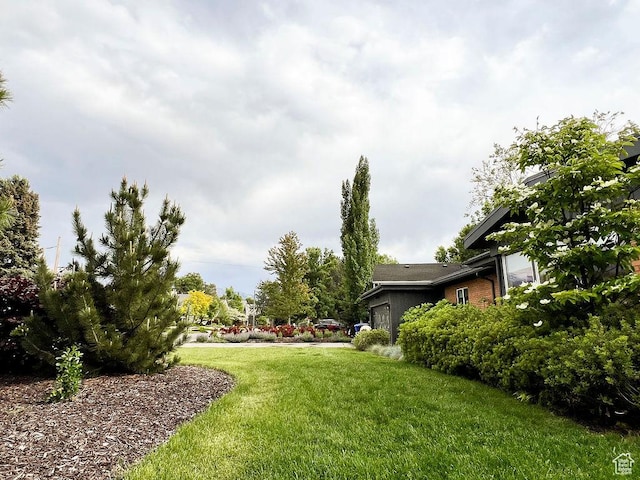 5466 S Woodcrest Dr, Holladay, UT 84117 - view of grassy yard featuring a garage