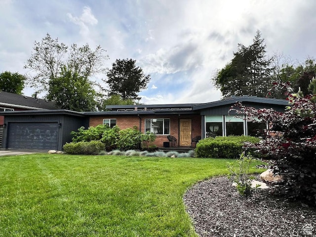 5466 S Woodcrest Dr, Holladay, UT 84117 - ranch-style home with an attached garage, a front lawn, and brick siding
