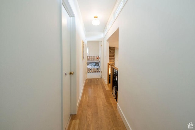 5466 S Woodcrest Dr, Holladay, UT 84117 - hallway with light wood-style flooring and baseboards