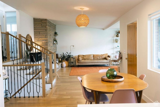 5466 S Woodcrest Dr, Holladay, UT 84117 - dining room featuring light wood-type flooring and stairway