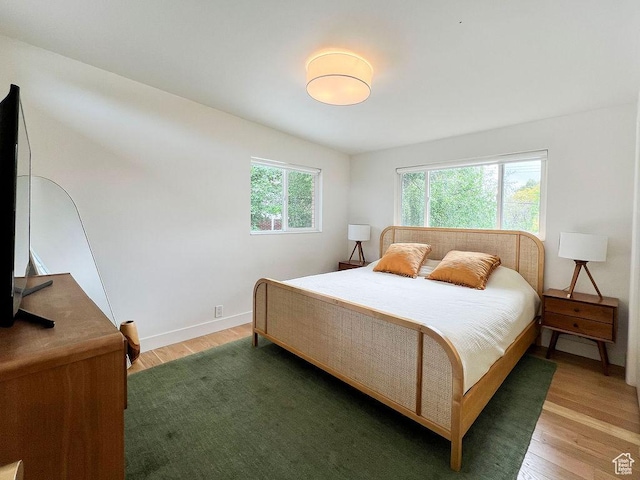 5466 S Woodcrest Dr, Holladay, UT 84117 - bedroom featuring light wood-style flooring and baseboards
