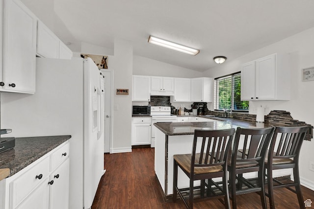 1240 N 2525 W, Layton, UT 84041 - kitchen featuring white appliances, lofted ceiling, a sink, a breakfast bar, and white cabinetry
