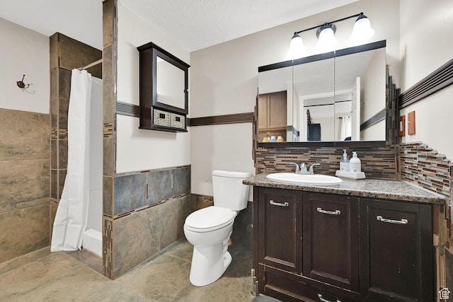 1240 N 2525 W, Layton, UT 84041 - full bath with toilet, vanity, wainscoting, and tile walls