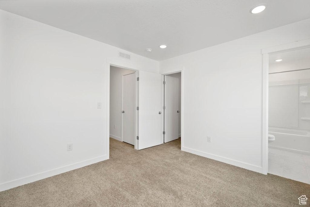 937 W Coalburn Way Unit 102, Murray, UT 84123 - unfurnished bedroom featuring light colored carpet, recessed lighting, baseboards, and connected bathroom