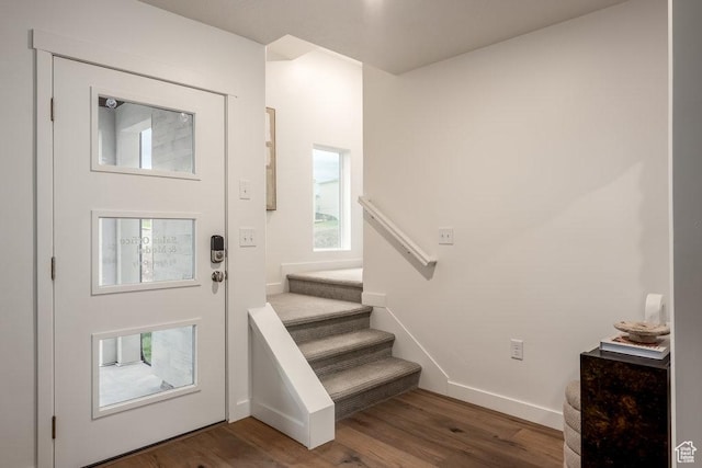 937 W Coalburn Way Unit 102, Murray, UT 84123 - foyer featuring wood finished floors, stairway, and baseboards