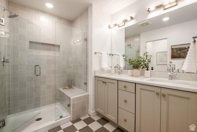937 W Coalburn Way Unit 102, Murray, UT 84123 - bathroom featuring a stall shower, double vanity, tile patterned floors, and recessed lighting