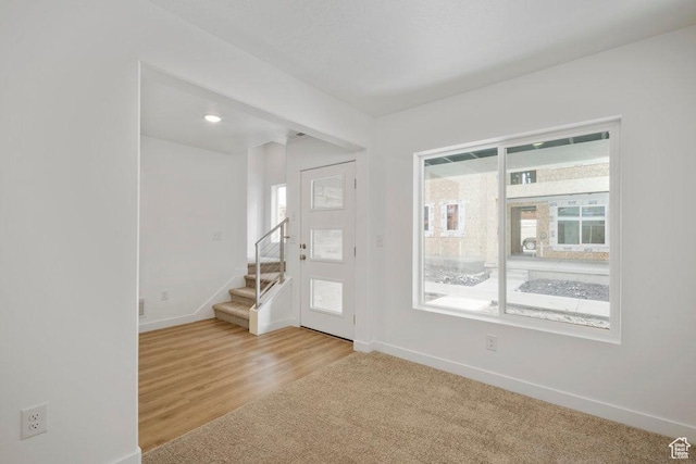 937 W Coalburn Way Unit 102, Murray, UT 84123 - foyer entrance featuring healthy amount of natural light, baseboards, and stairs