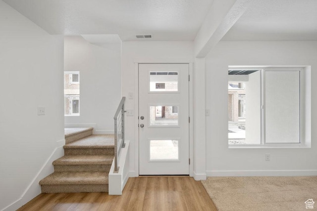 937 W Coalburn Way Unit 102, Murray, UT 84123 - entryway with stairway, plenty of natural light, light wood-type flooring, and baseboards