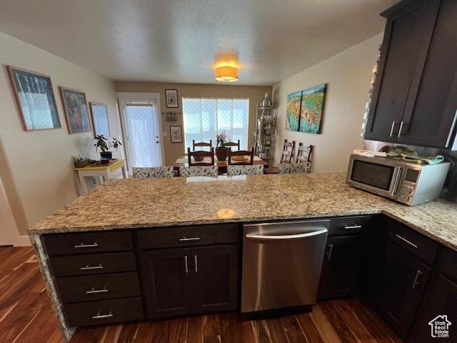 115 E 8469 S, Sandy, UT 84070 - kitchen with stainless steel appliances, a peninsula, dark wood-type flooring, and light stone countertops