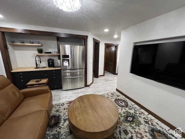 115 E 8469 S, Sandy, UT 84070 - living area featuring baseboards, recessed lighting, and light wood-style flooring