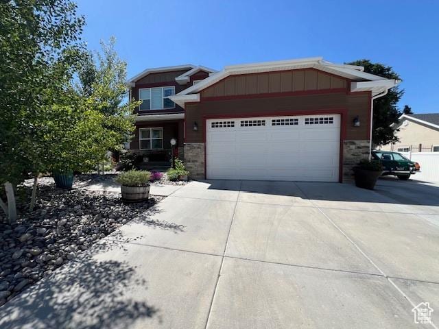 115 E 8469 S, Sandy, UT 84070 - craftsman-style house with stone siding, driveway, a garage, and board and batten siding