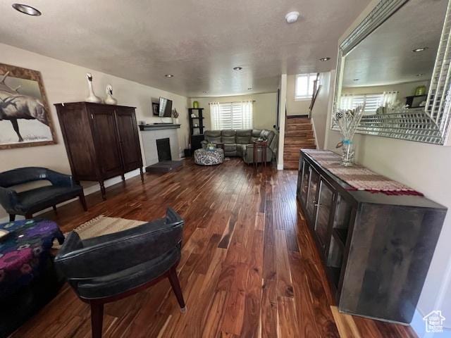 115 E 8469 S, Sandy, UT 84070 - living room with dark wood-style flooring, stairway, a fireplace, and recessed lighting