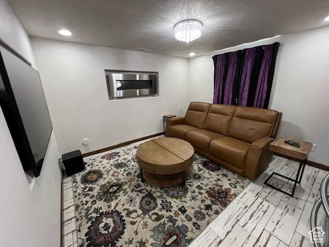 115 E 8469 S, Sandy, UT 84070 - living room with recessed lighting, baseboards, and a chandelier