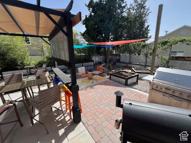 115 E 8469 S, Sandy, UT 84070 - view of patio / terrace featuring outdoor dining area and a grill