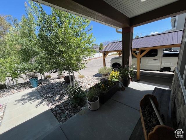 115 E 8469 S, Sandy, UT 84070 - view of patio / terrace featuring a carport
