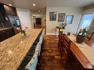 115 E 8469 S, Sandy, UT 84070 - kitchen with dark wood-style floors, recessed lighting, light stone countertops, and baseboards