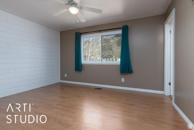 1280 N Gramercy Ave, Ogden, UT 84404 - spare room featuring light wood-style floors, a ceiling fan, and baseboards
