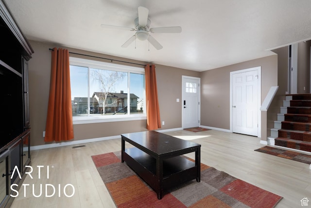 1280 N Gramercy Ave, Ogden, UT 84404 - living room featuring light wood-type flooring, ceiling fan, stairs, and baseboards