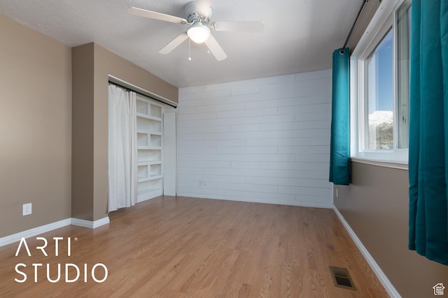 1280 N Gramercy Ave, Ogden, UT 84404 - unfurnished bedroom featuring wood finished floors, a ceiling fan, and baseboards