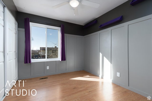 1280 N Gramercy Ave, Ogden, UT 84404 - empty room with a decorative wall, ceiling fan, and wood finished floors