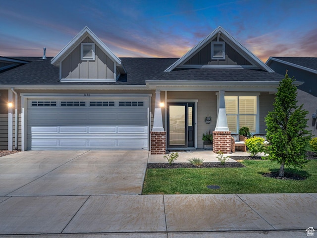 1136 W 1810 S, Orem, UT 84058 - view of front facade featuring board and batten siding, an attached garage, driveway, a porch, and a shingled roof