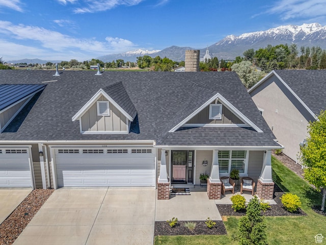 1136 W 1810 S, Orem, UT 84058 - craftsman house with roof with shingles, concrete driveway, a porch, a mountain view, and board and batten siding