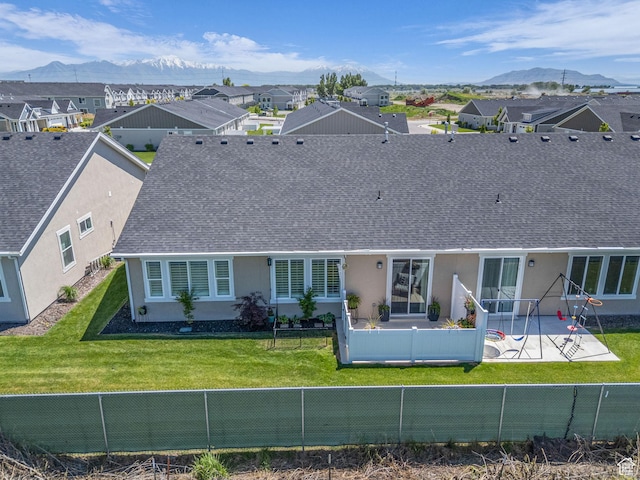 1136 W 1810 S, Orem, UT 84058 - back of property featuring a patio area, a mountain view, roof with shingles, stucco siding, and a residential view
