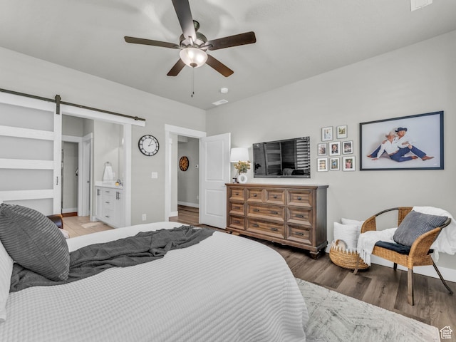 1136 W 1810 S, Orem, UT 84058 - bedroom with a barn door, wood finished floors, ceiling fan, and baseboards