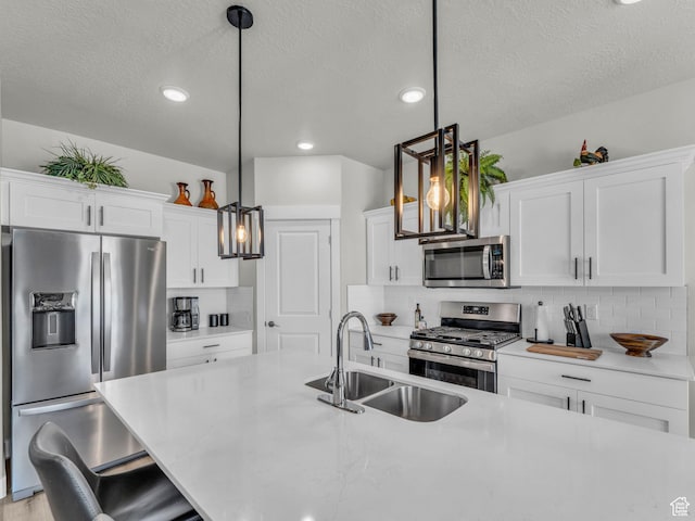 1136 W 1810 S, Orem, UT 84058 - kitchen featuring stainless steel appliances, a sink, light countertops, a textured ceiling, and tasteful backsplash
